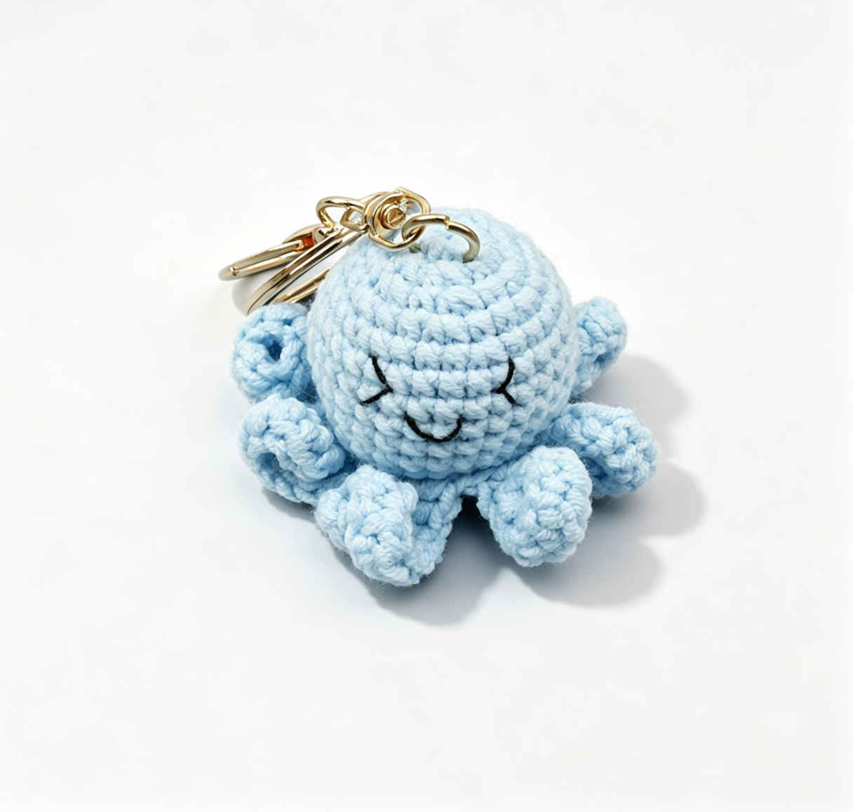 Blue crochet octopus keychain handmade with the crochet octopus DIY kit