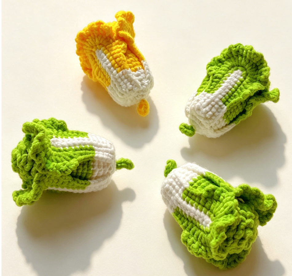 Four finished crochet cabbage plush toys in green and yellow colors made with DIY crochet kit