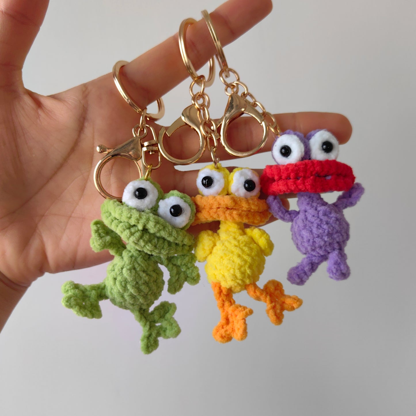 Detailed side view of crochet animals showing soft yarn texture and neat stitches