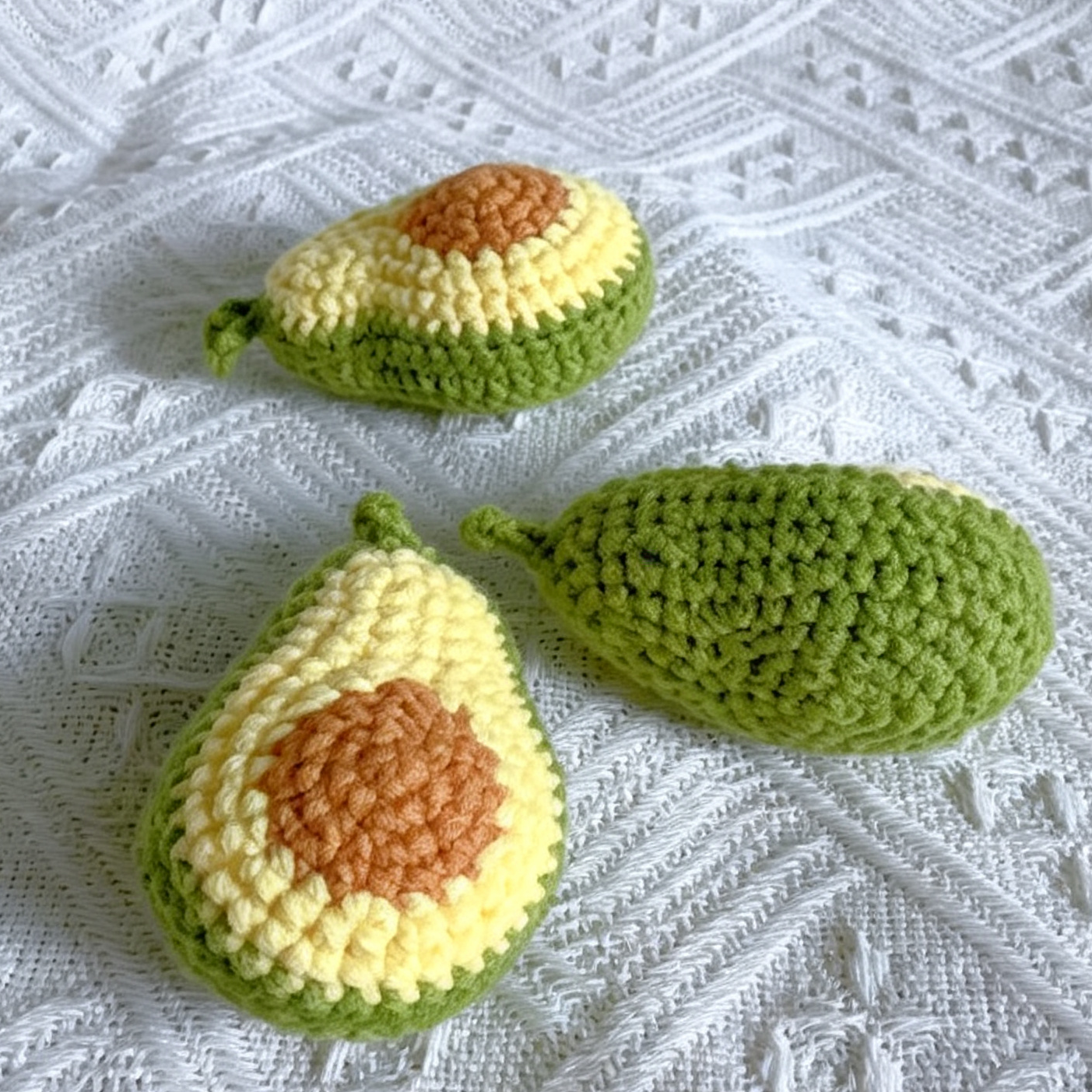 Close-up detail of handmade crochet avocado plush keychain