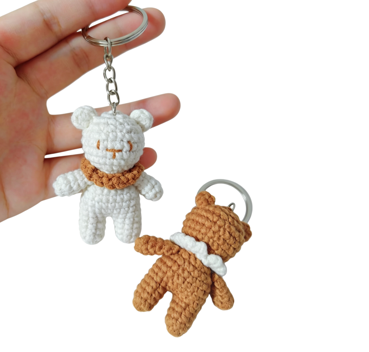 Handmade white mini crochet bear keychain close-up detail