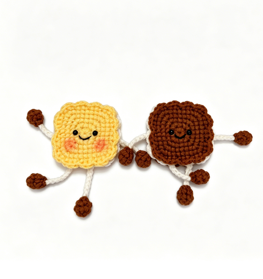 Crochet Biscuit Keychain Kit featuring yellow and brown biscuit keychains displayed together in a flat lay arrangement