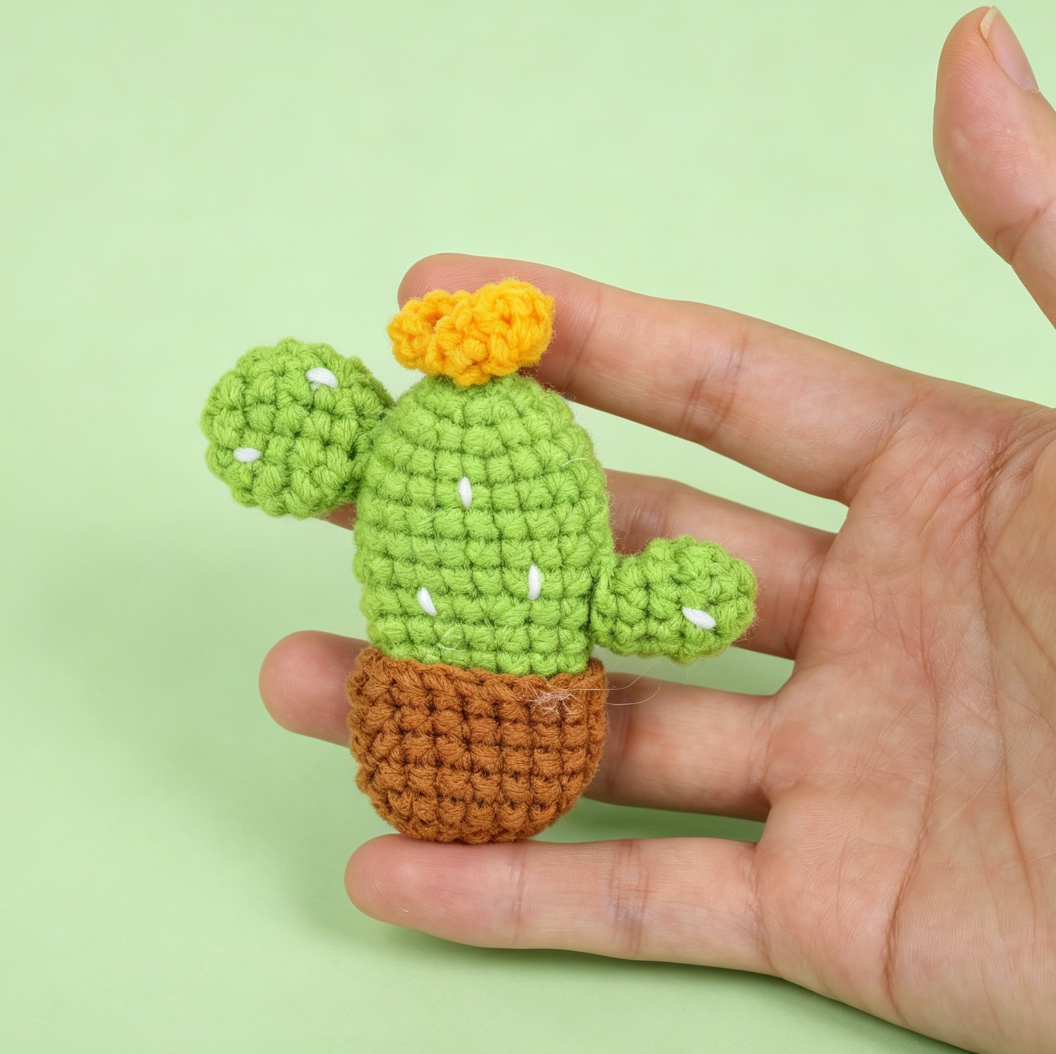 Close-up front view of handmade crochet cactus keychains with adorable details