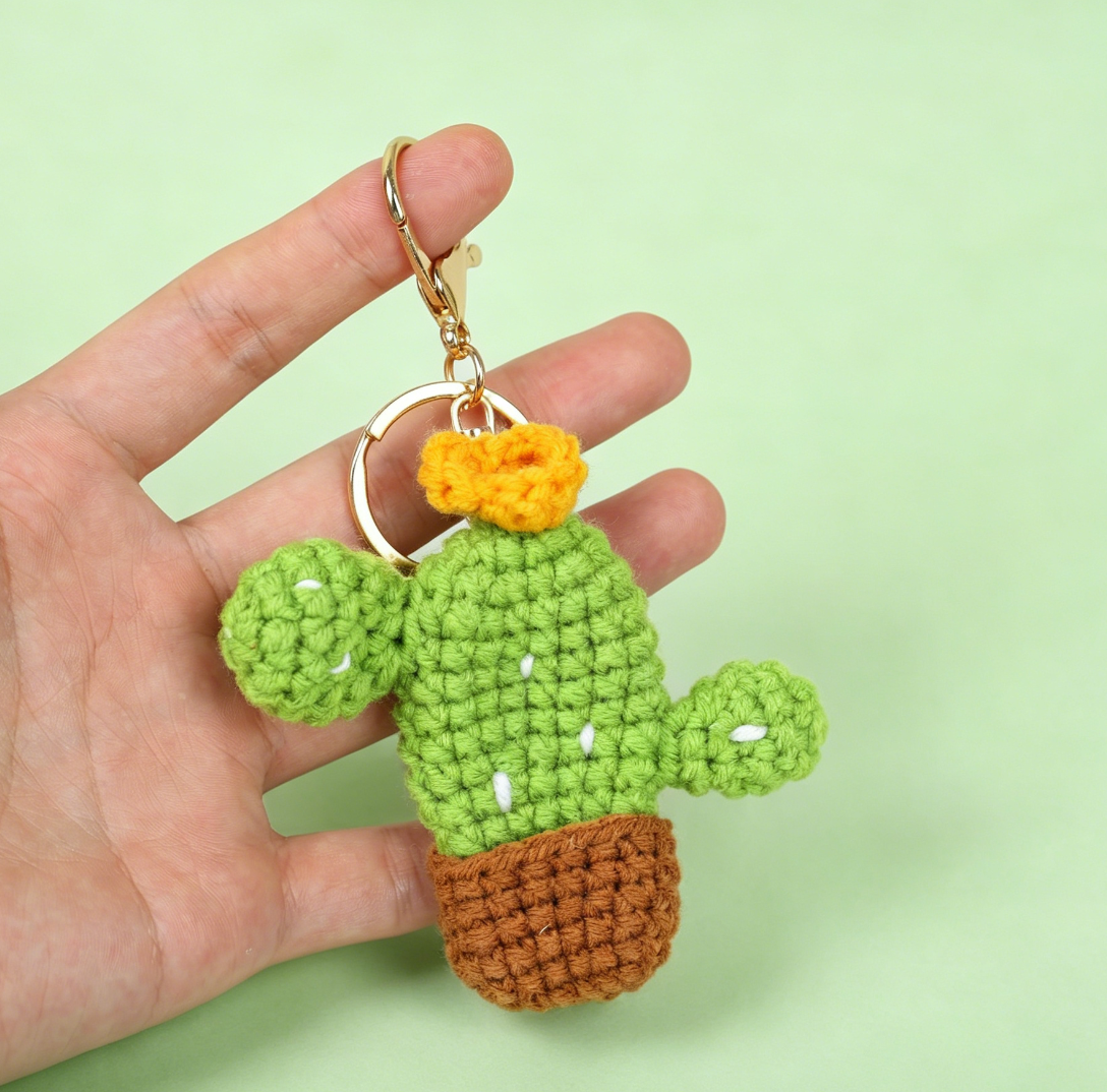 Detailed view of mini crochet cactus keychain charms showing texture and craftsmanship