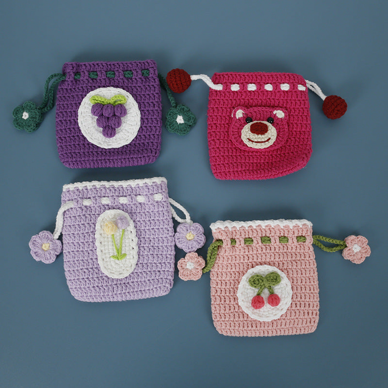 Four crochet drawstring pouches together: Tulip, Cherry, Grape, Strawberry Bear