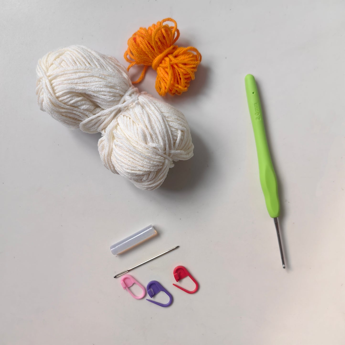 All materials included in the crochet goose earphone case kit