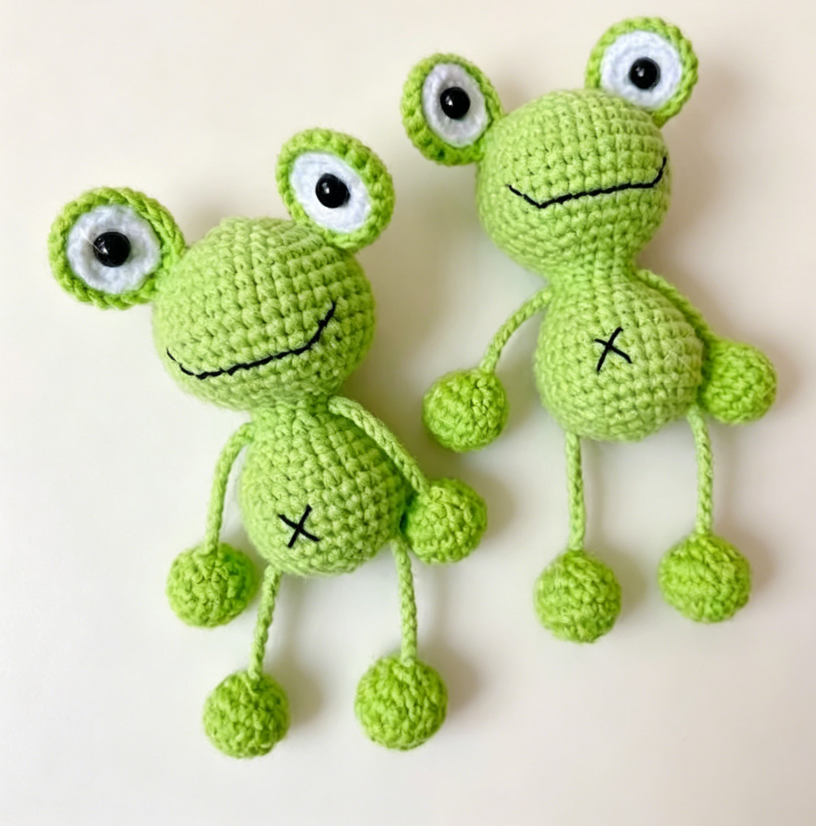 Crochet hanging frog kit finished products display, two cute frog keychains made with crochet