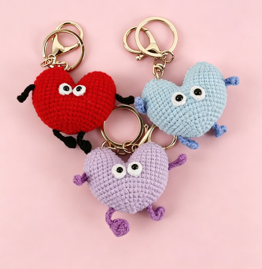 Crochet Heart Plush Kit featuring red, purple, and blue crochet heart keychains displayed together