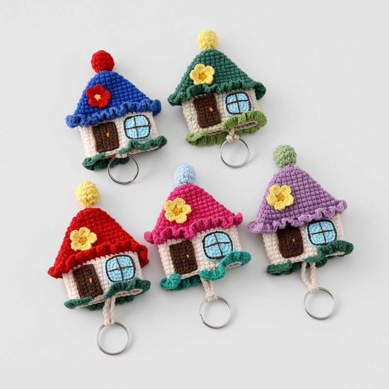 Crochet house key cover kit featuring five colorful house-shaped key covers displayed together