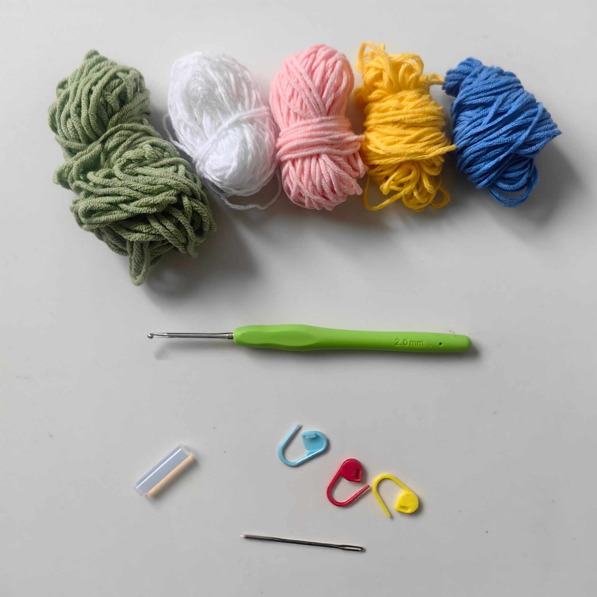 Complete crochet Lily of the Valley kit materials with yarn and accessories
