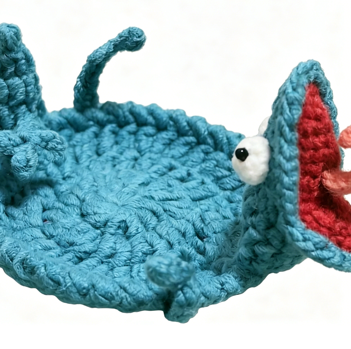 Crochet lizard coaster showcasing detailed craftsmanship and realistic lizard shape