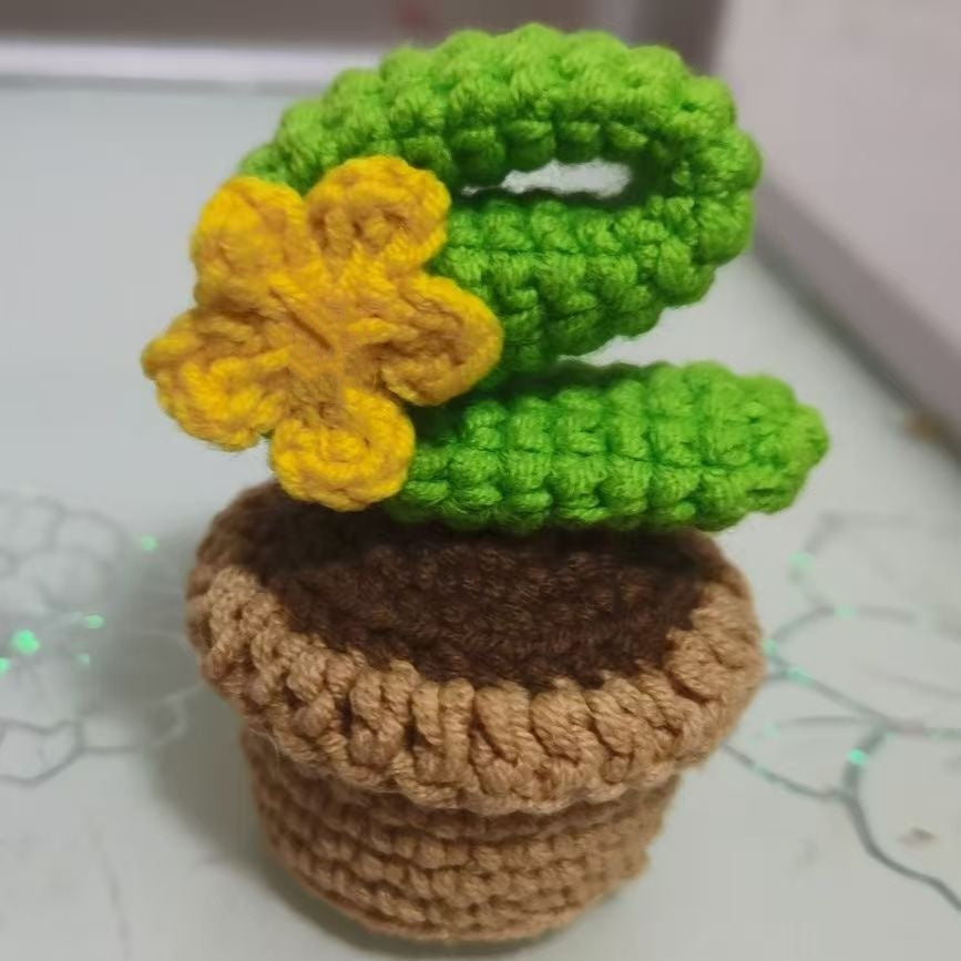 Crochet cactus plush shaped as the letter E