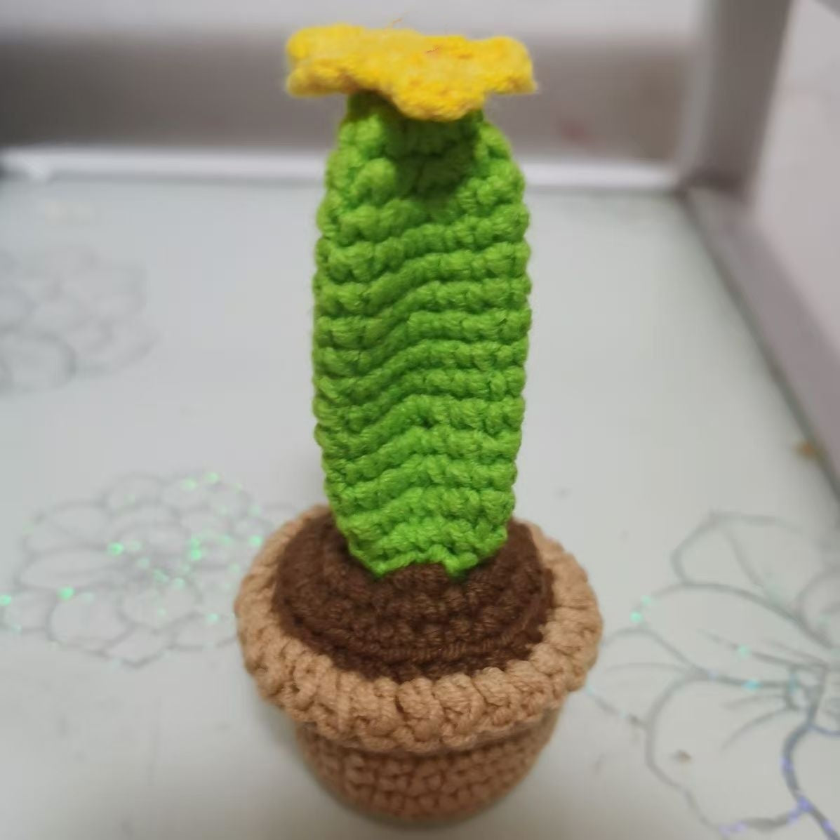Crochet cactus plush shaped as the letter L