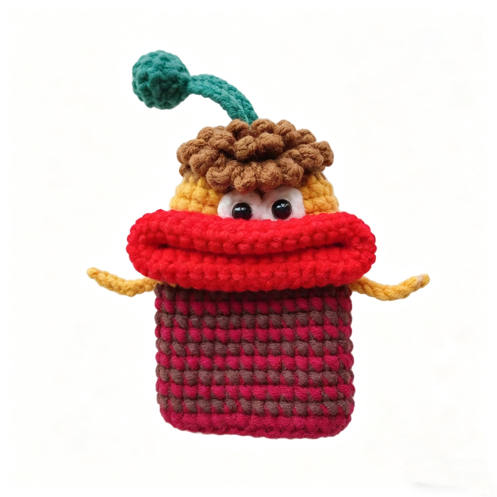 Red crochet monster key cover close-up with funny big mouth design