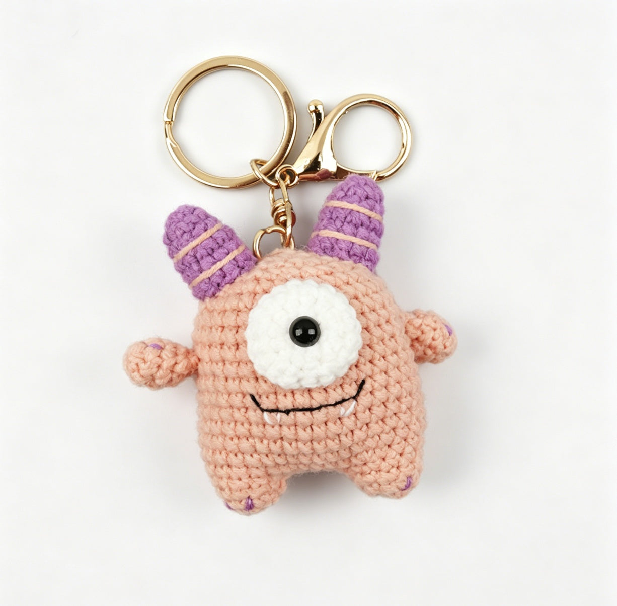 Pink crochet monster keychain handmade with beginner crochet kit