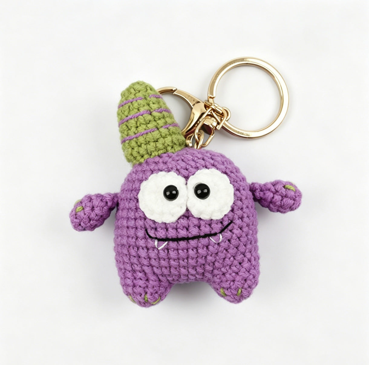Purple crochet monster keychain made with DIY crochet kit