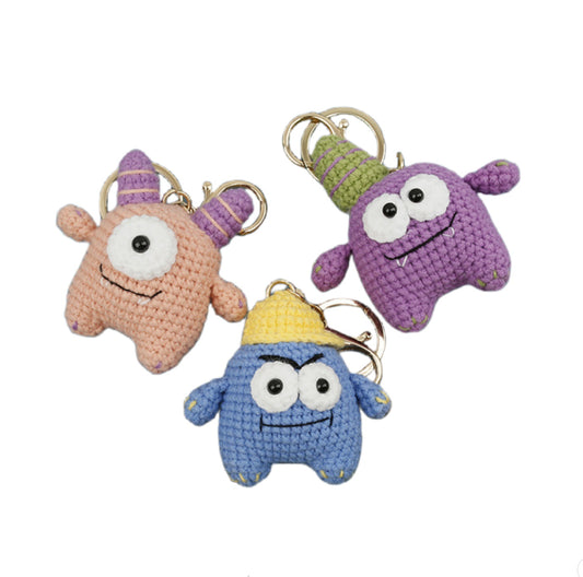 Crochet Monster Keychain Kit with purple, pink and blue finished monsters