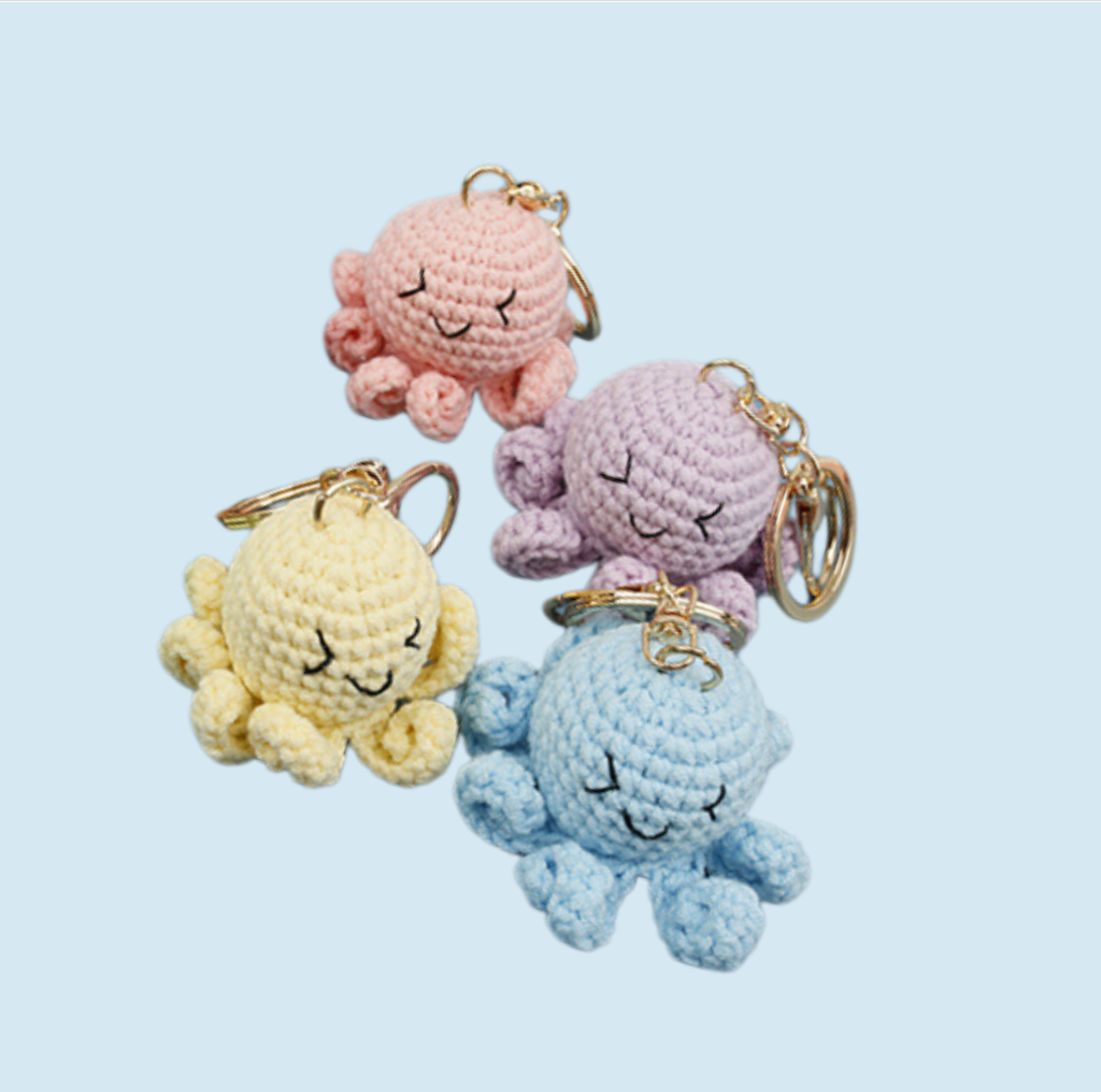 Cute crochet octopus kit with four colorful octopus keychains in yellow, purple, pink and blue