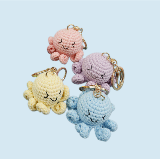 Cute crochet octopus kit with four colorful octopus keychains in yellow, purple, pink and blue