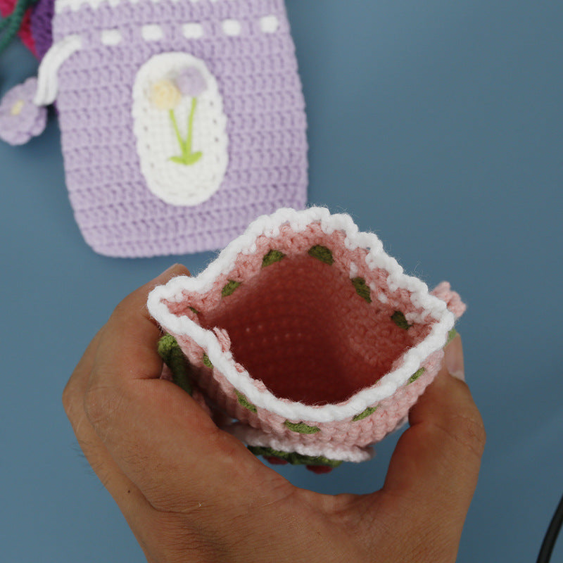 Interior of the crochet drawstring pouch showing small essentials