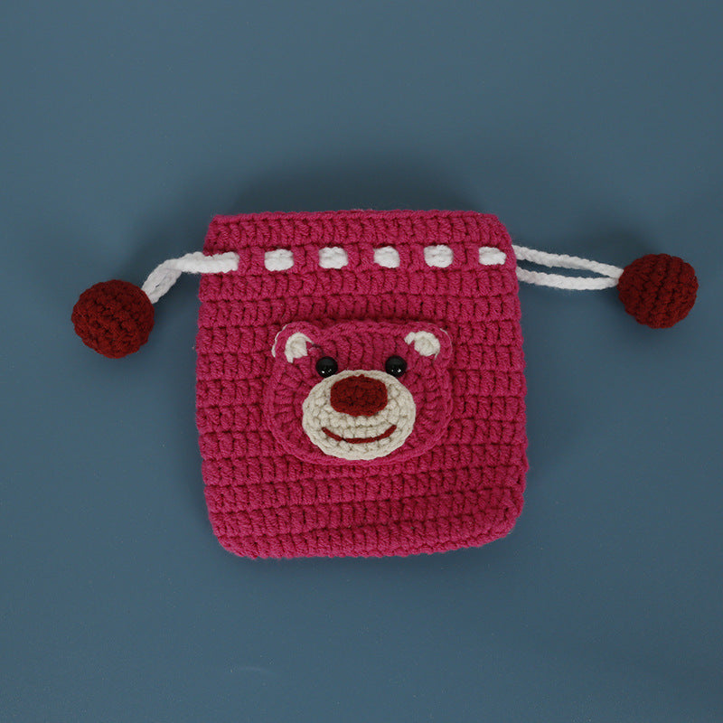 Strawberry Bear design crochet pouch on a flat surface