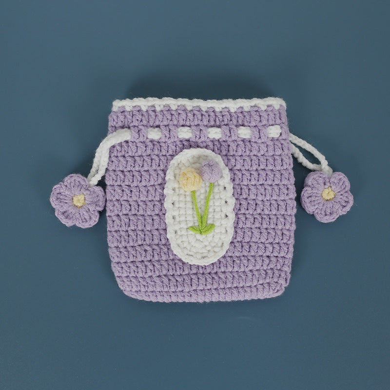 Tulip design crochet pouch on a flat surface