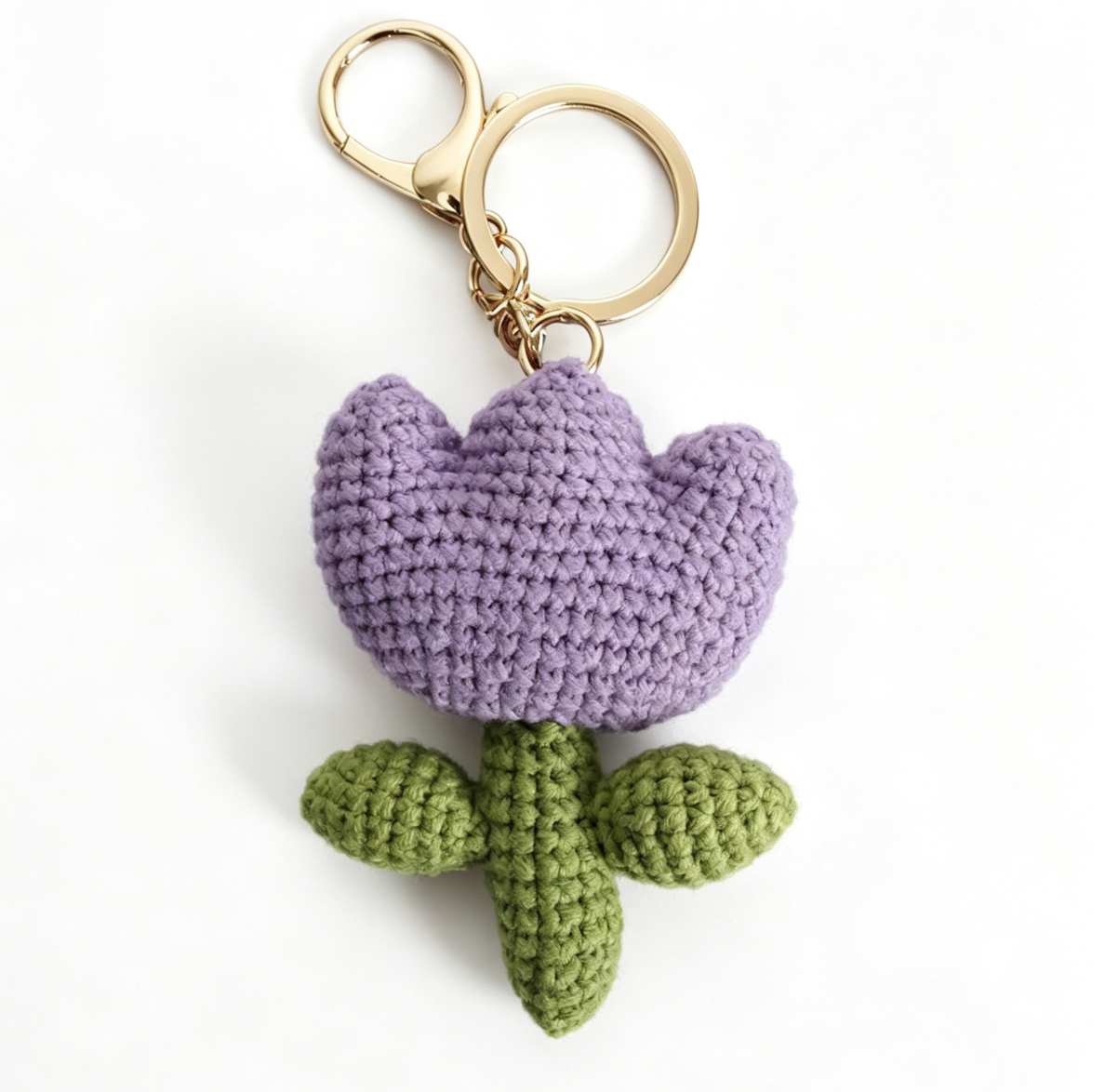 Purple crochet tulip flower keychain created from beginner crochet kit
