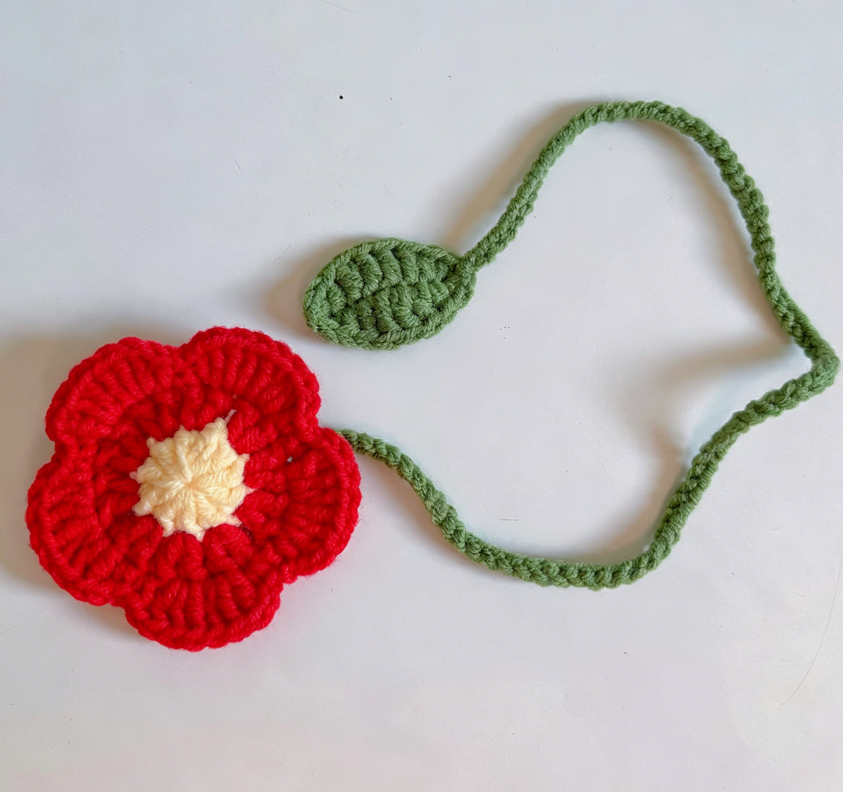 Red crochet flower bookmark with delicate handmade details