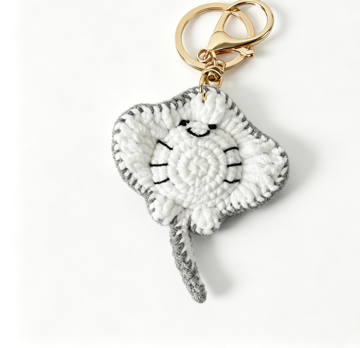 Gray crochet stingray keychain with adorable shape and detailed handmade craftsmanship
