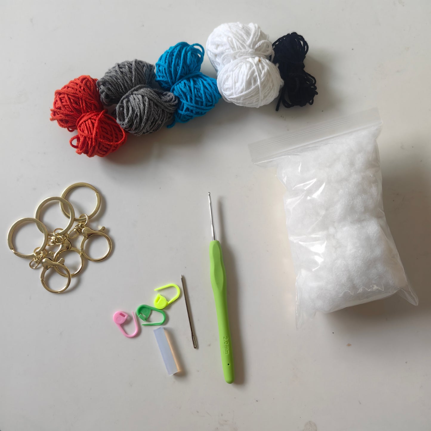 Crochet Stingray Keychain Kit with yarn, crochet hook, stuffing, keychain accessories and complete DIY materials