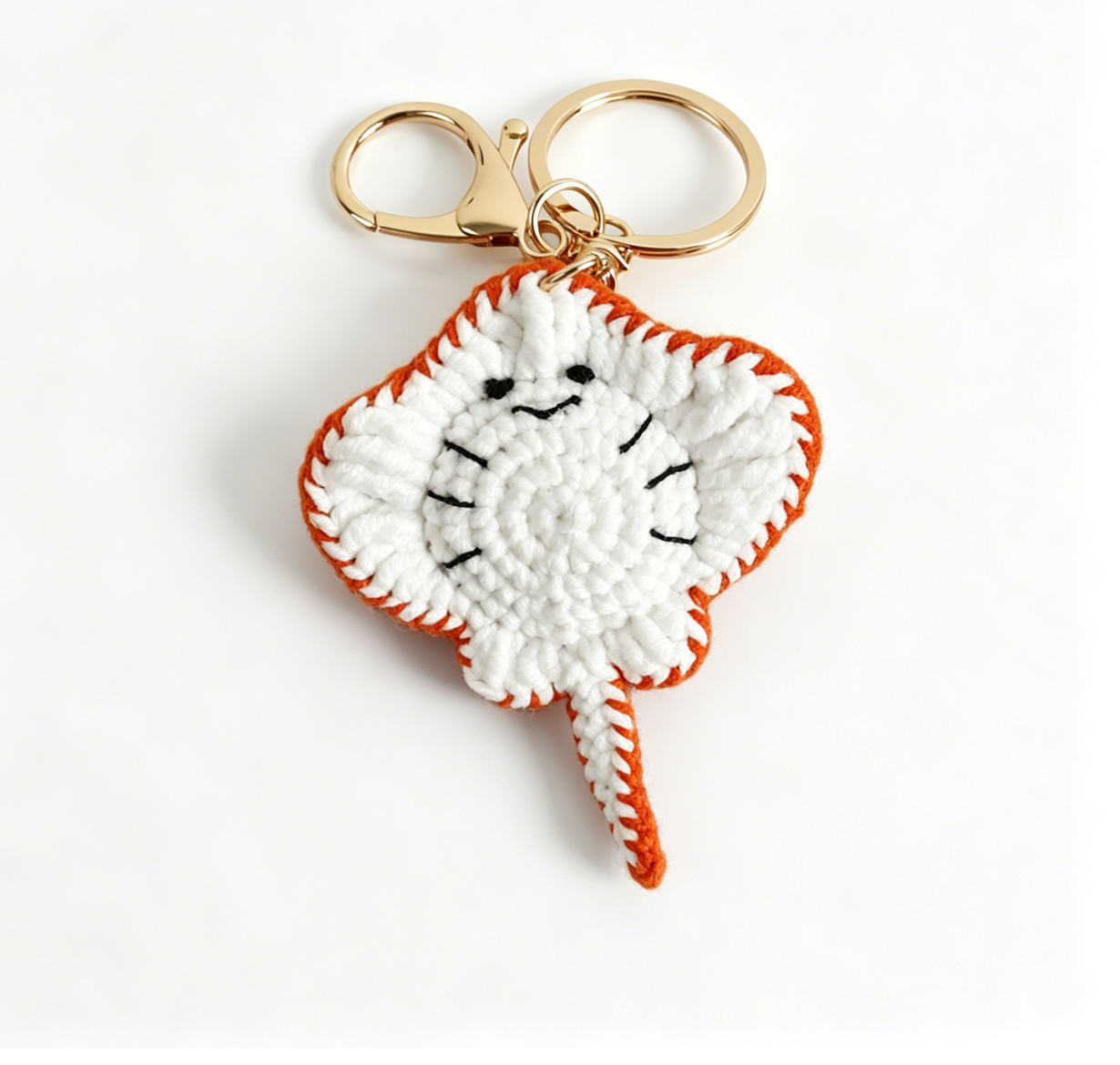 Red crochet stingray keychain featuring a cute ray design for bags and keys