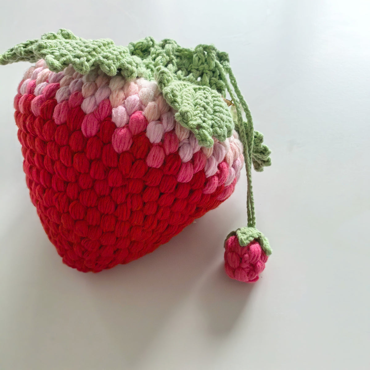 Crochet strawberry drawstring pouch side view