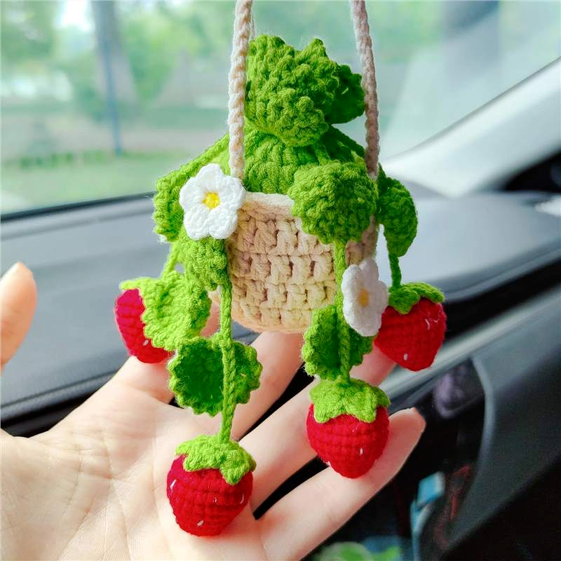 Close-up of the crochet strawberry with mini basket showing detailed stitches