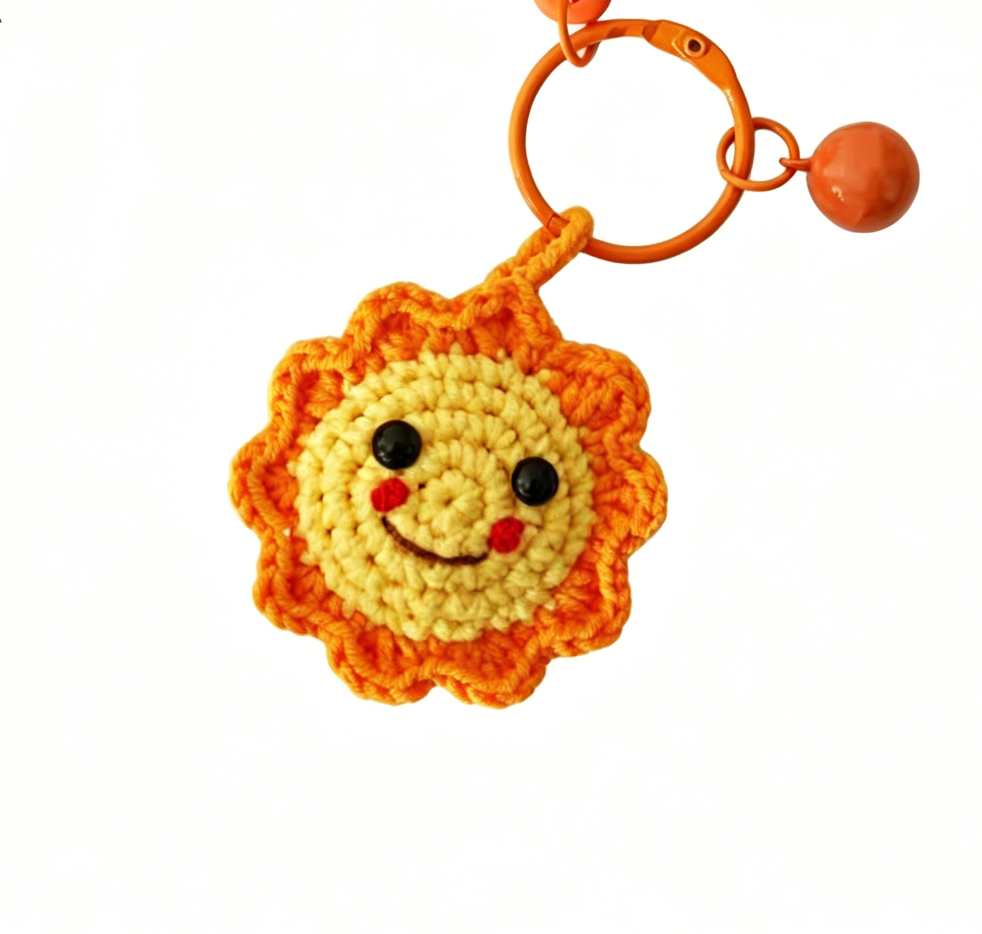Handmade crochet sun accessory charm made with soft yarn and beginner-friendly pattern