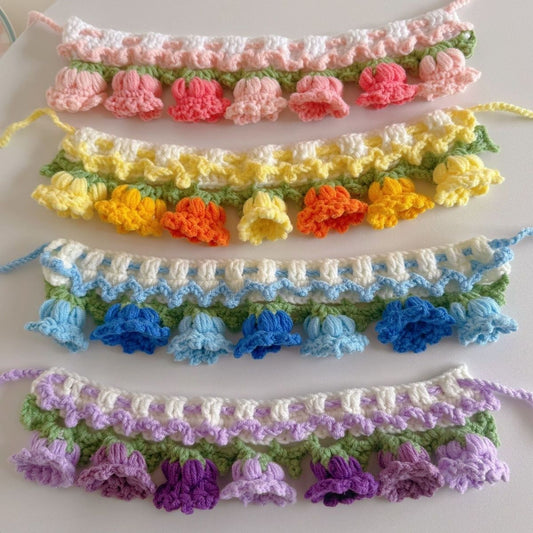 Handmade crochet tulip cat collars in yellow, pink, blue, and purple