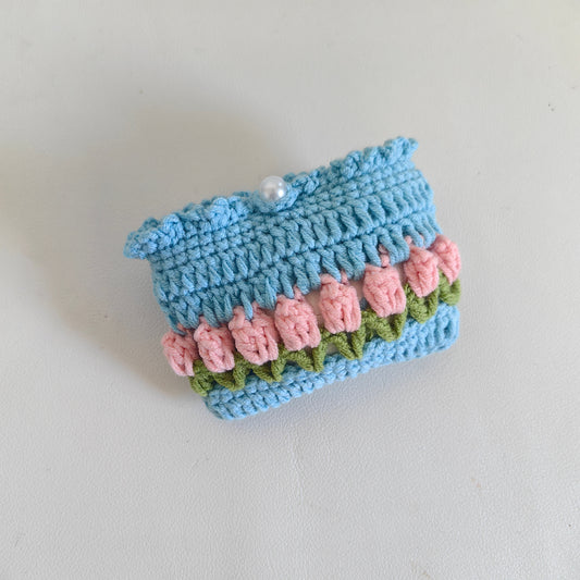 Crochet tulip earphone pouch with earbuds inside