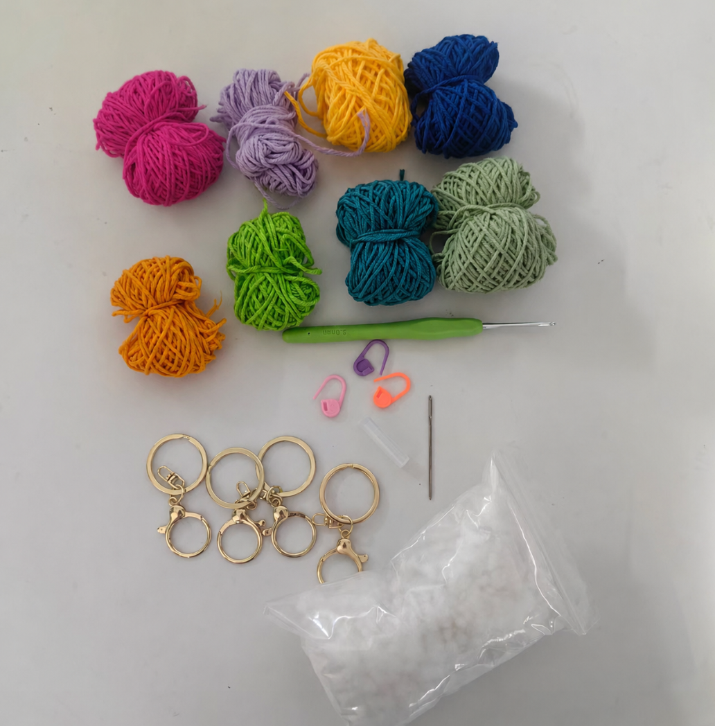 Complete crochet tulip kit materials including yarn, crochet hook, accessories, stuffing, and instructions
