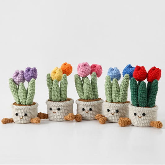 handmade crochet tulip plant dolls with smiley face pots in five colors displayed together