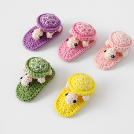 handmade crochet turtle hair clips in five colors flat lay