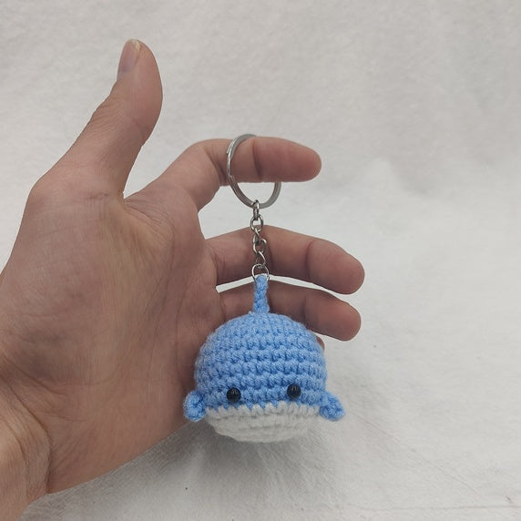 Handmade blue crochet whale keychain close-up cute mini whale detail