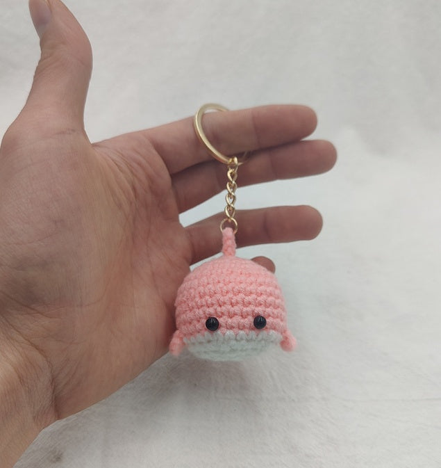 Handmade pink crochet whale keychain close-up cute mini whale detail
