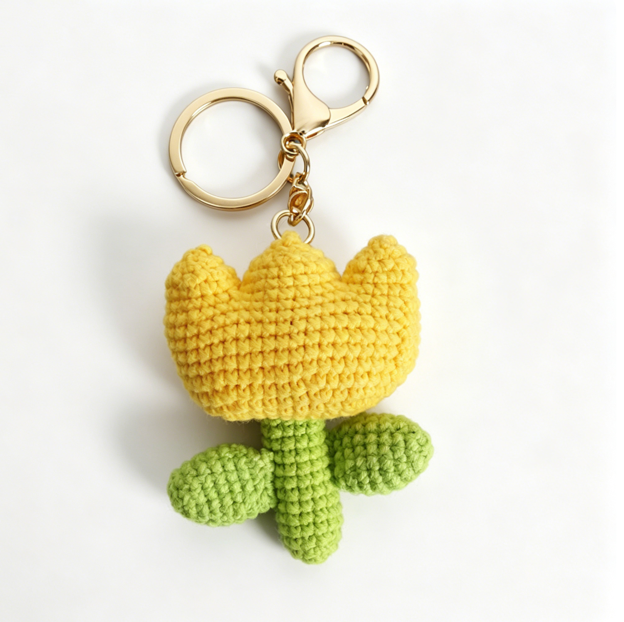 Yellow crochet tulip keychain made with DIY crochet flower kit