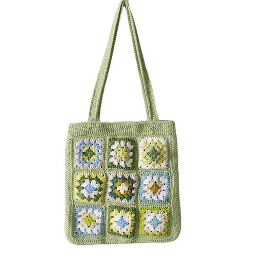 Green floral granny square crochet tote bag displayed on white background, handmade knitted shoulder bag