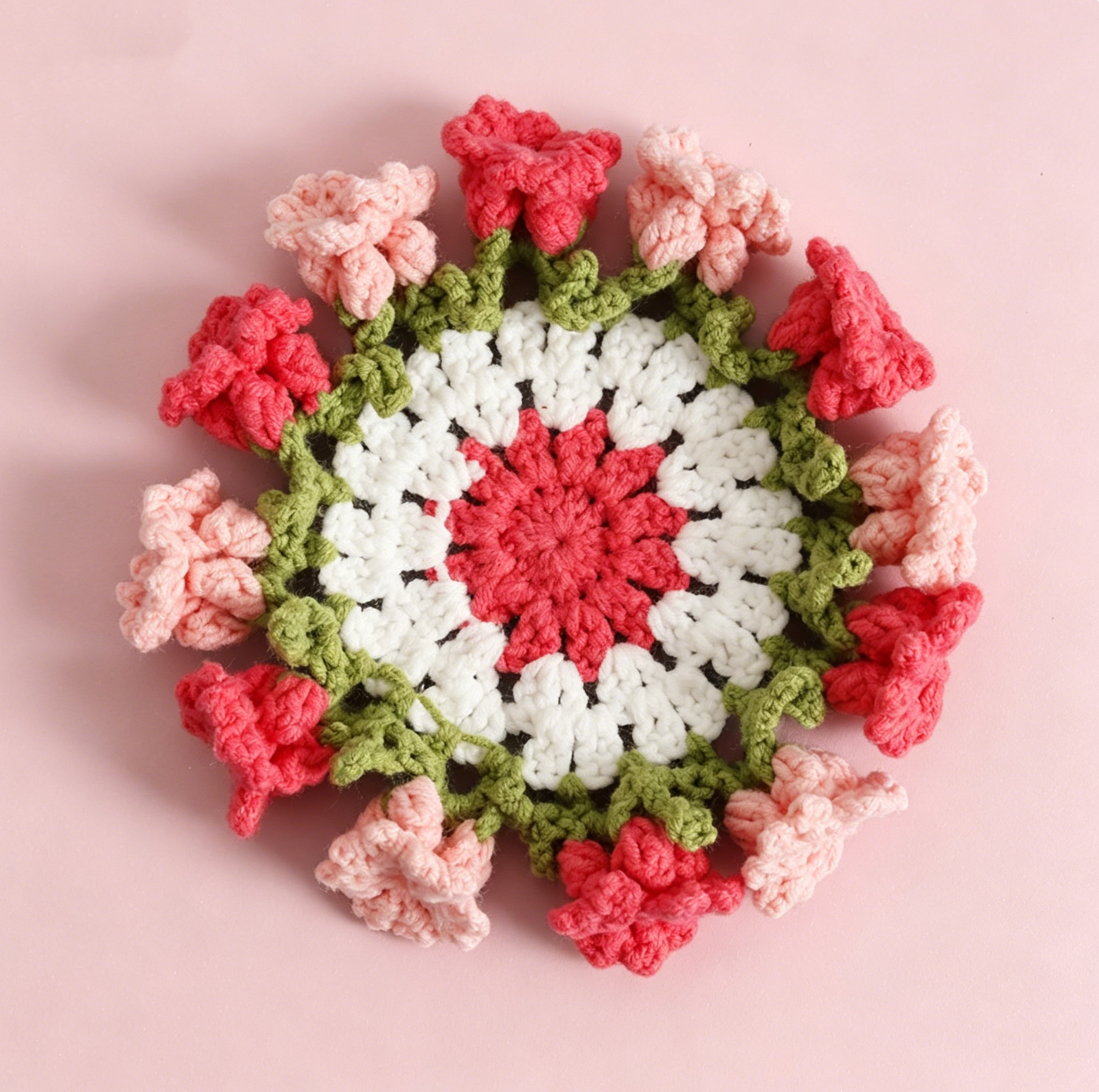 Pink Lily of the Valley crochet coaster created with the beginner-friendly Crochet Lily Coaster Kit