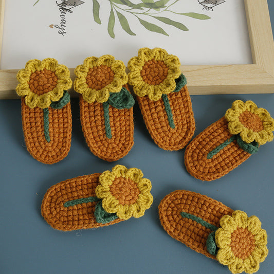 Set of sunflower crochet hair clips showing multiple clips together