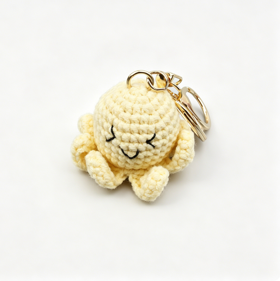 Handmade yellow crochet octopus keychain made with the crochet octopus kit